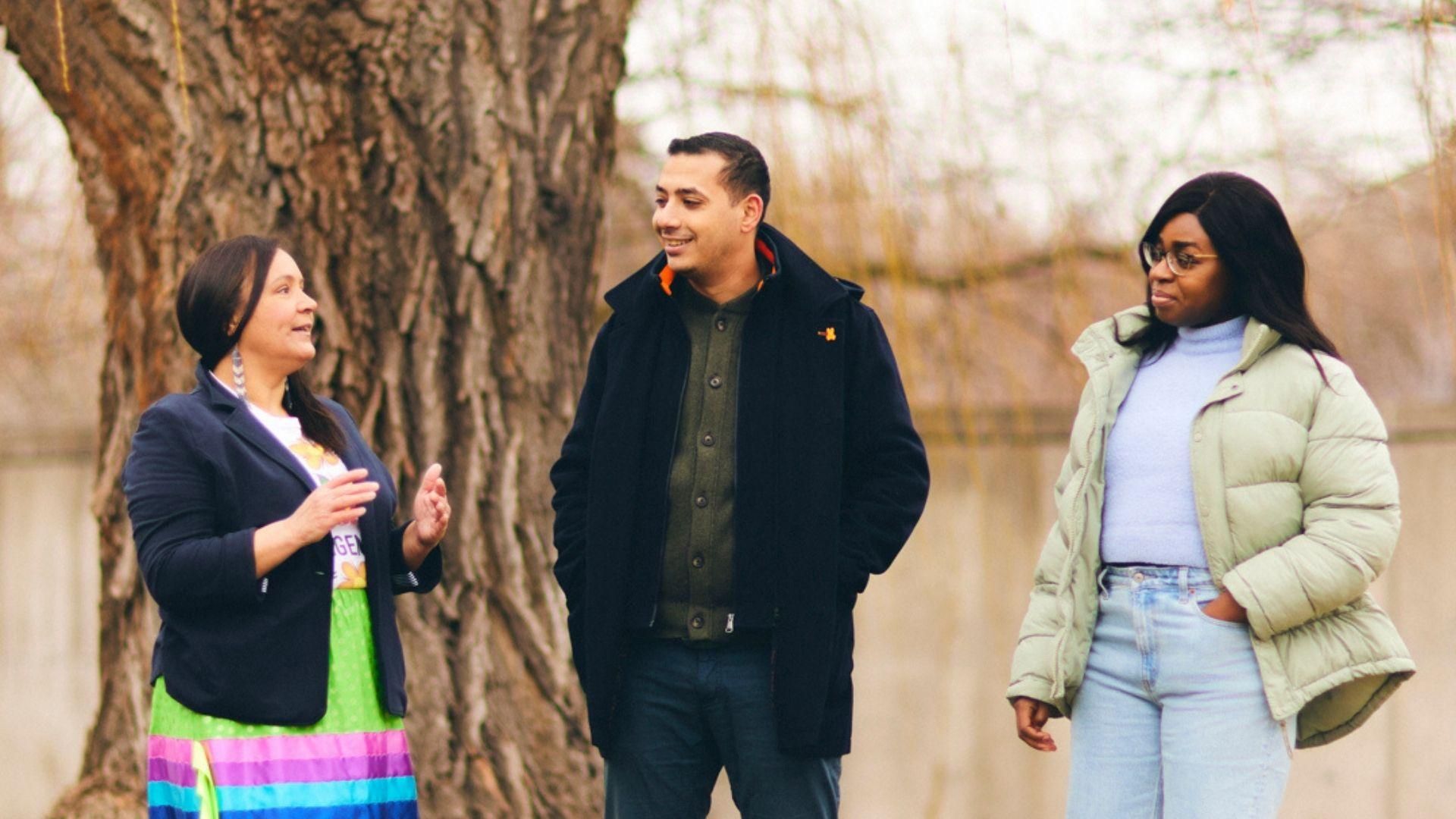 Three Sanofians talking outside