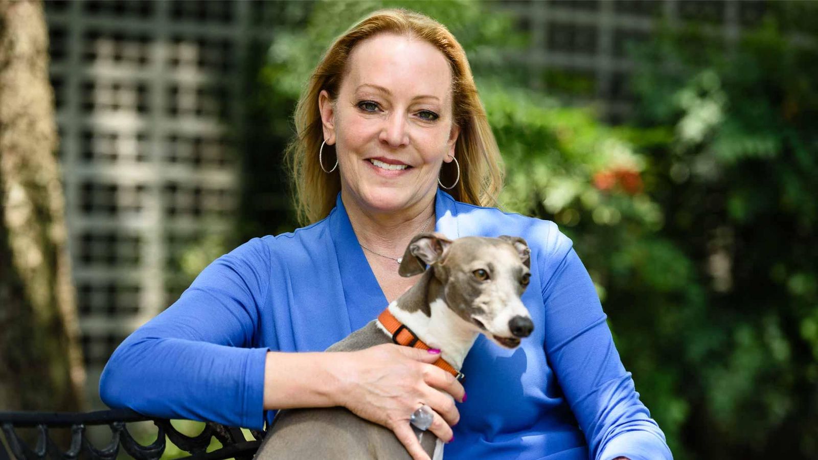 Portrait of Elizabeth, living with atopic dermatitis in the US, with her dog