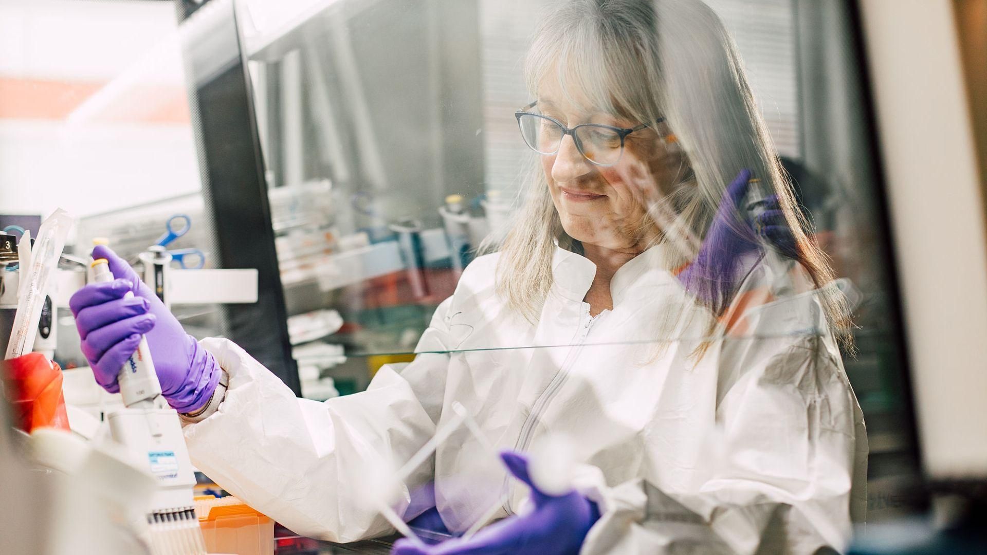 Christine Dureuil Sizaire, Principal Scientist, conducting laboratory research with a pipette at Sanofi